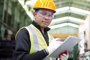 Maintenance worker at a chemical plant proof testing safety devices